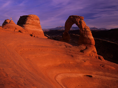 Hikers View Delicate Arch at Sunset, Utah, USA